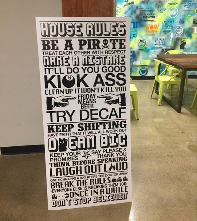 A large sign with funny House Rules