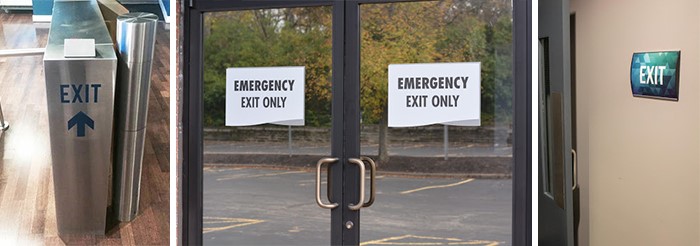 Signs and decals are placed around to guide visitors to the exit