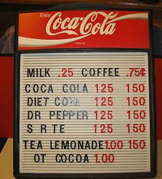 A vintage menu board sign advertising drinks