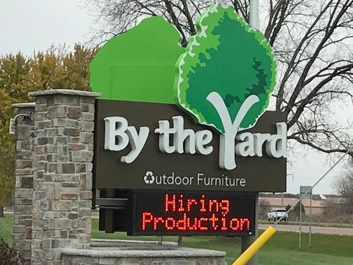 By the Yard uses a digital sign with their monument sign