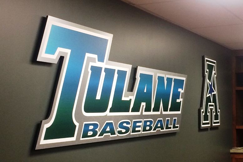 A Tulane Baseball sign hung up on a wall