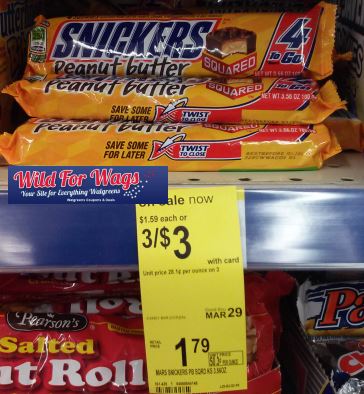 Peanut Butter Snickers are advertised with a sign saying 3 for $3
