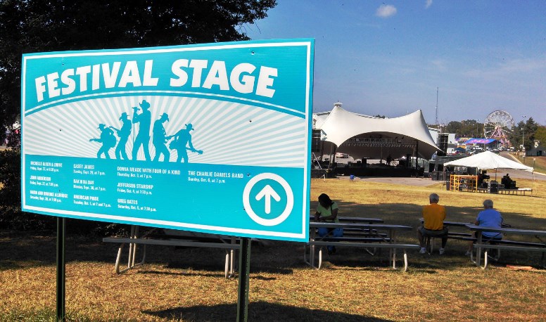 The State Fair of VA has a sign pointing to the festival stage