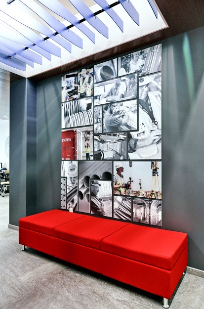 Wall graphics are used on a manufacturing company's wall