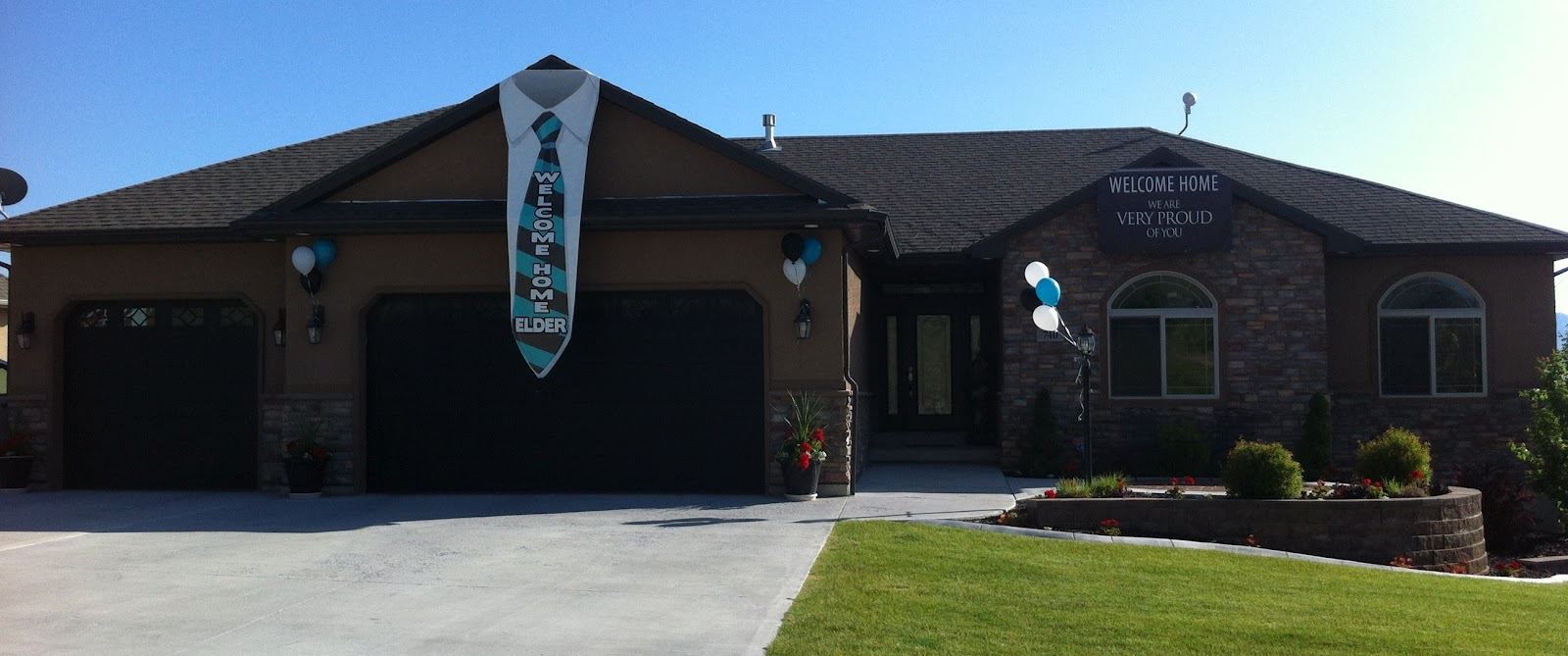 A home is decorated with welcome home signage featuring a sign that looks like a tie