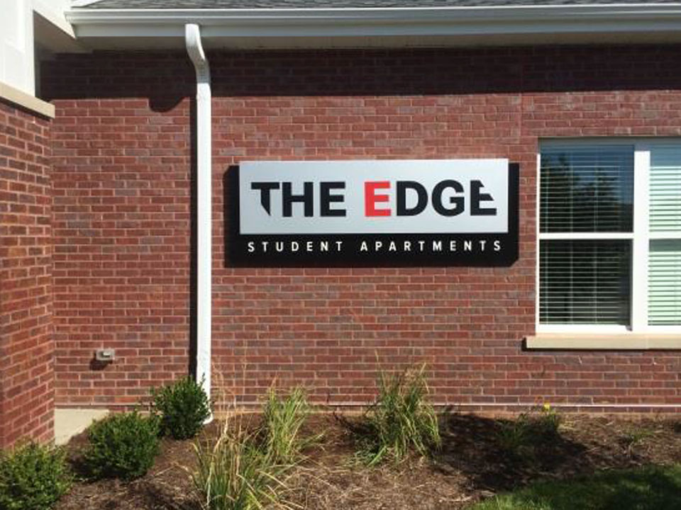The edge student apartments sign