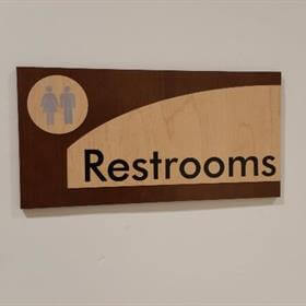 wood restroom sign