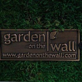 garden on the wall metal sign