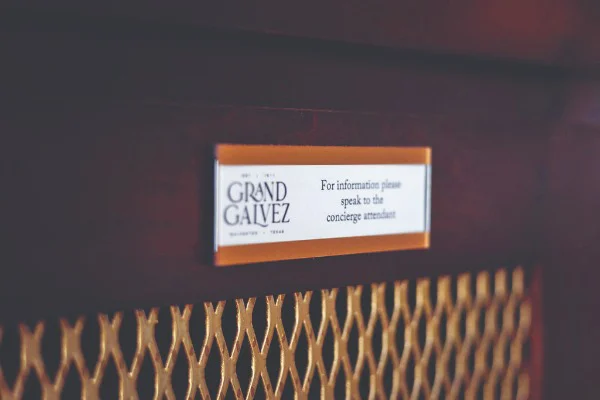 a sign on a hotel wall 
