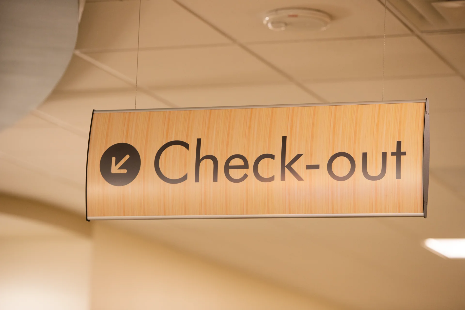 a sign that reads "check out" with an arrow