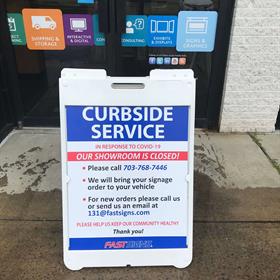 An A frame sign indicates curbside service