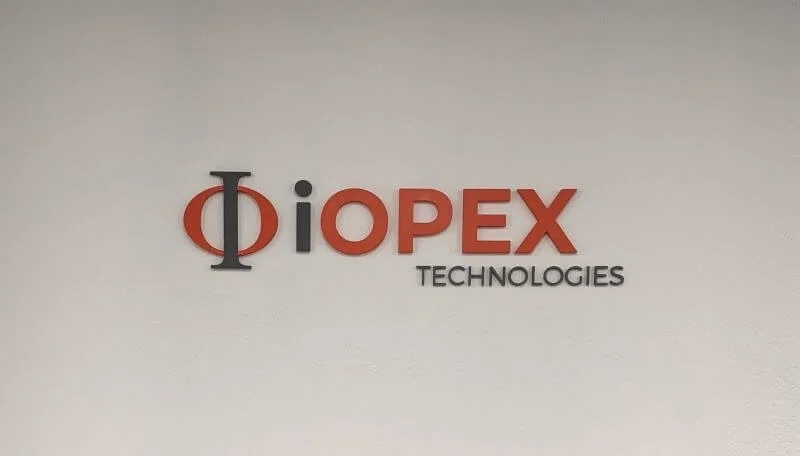An image of the iOPEX Technologies interior dimensional letters and logo.