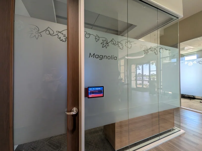 An image of the Magnolia interior privacy window film on the door and windows of an office.