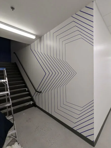 An image of the interior wall graphic decor near the stairwell.