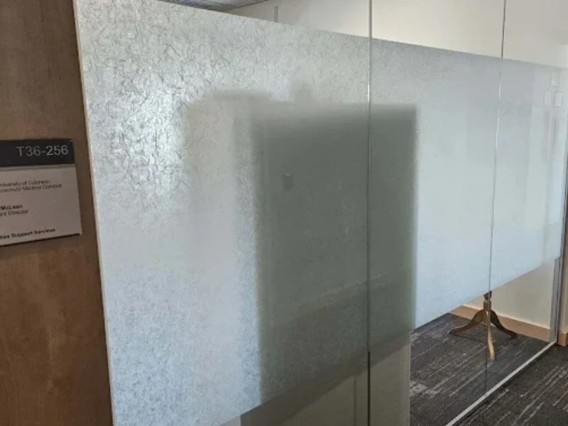 An image of frosted vinyl graphics for meeting room privacy.