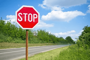 a stop sign next to a street