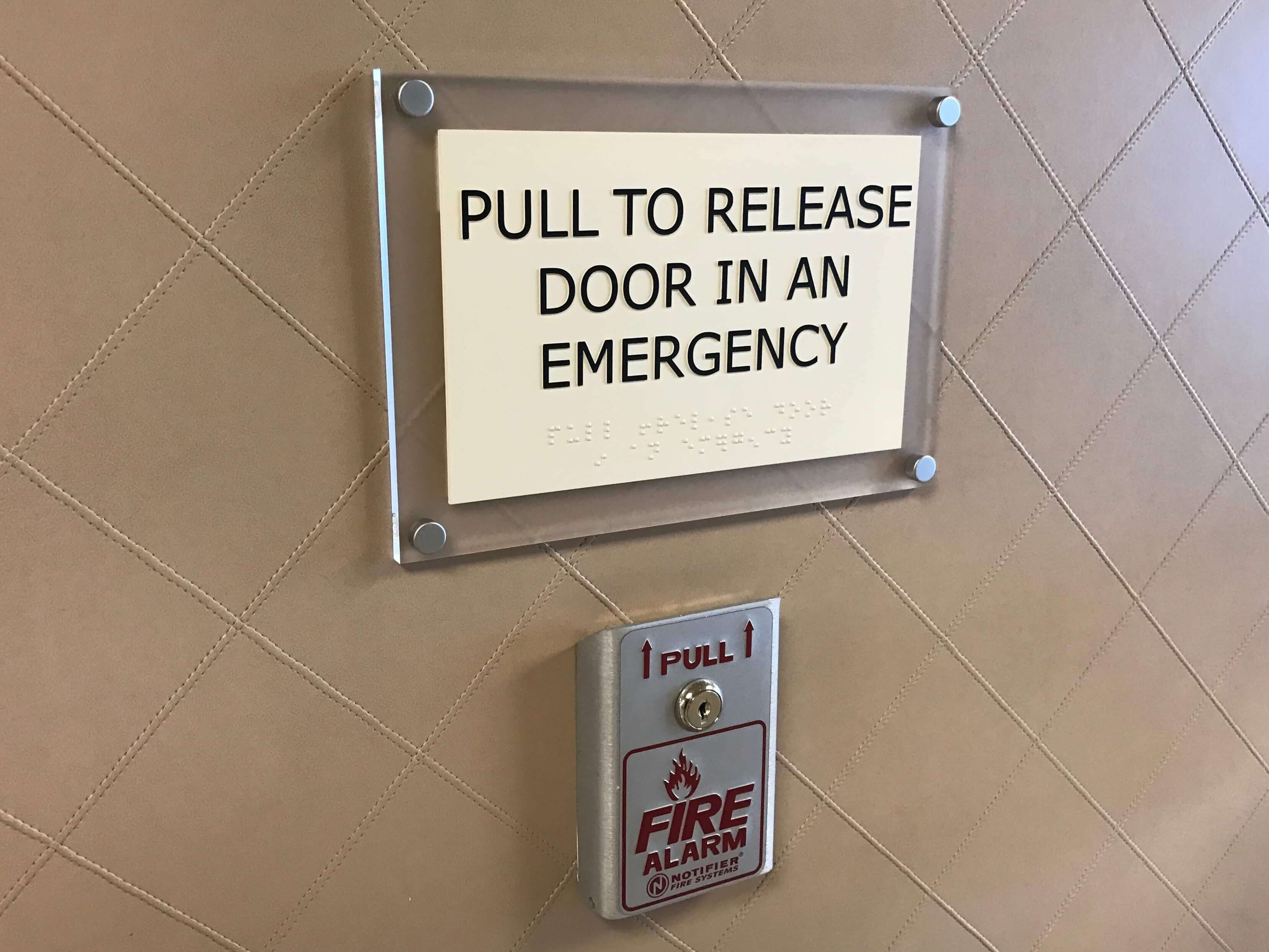 ADA sign for emergency exit