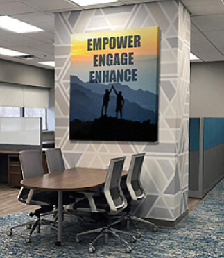 canvas sign that reads empower engage enhance