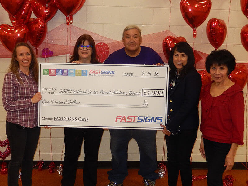 Fast sign donates $1000 to selected charity