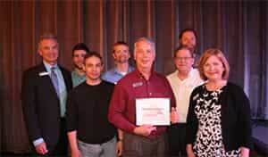 the team at FASTSIGNS of Asheville received an award as a Sky High Growth business