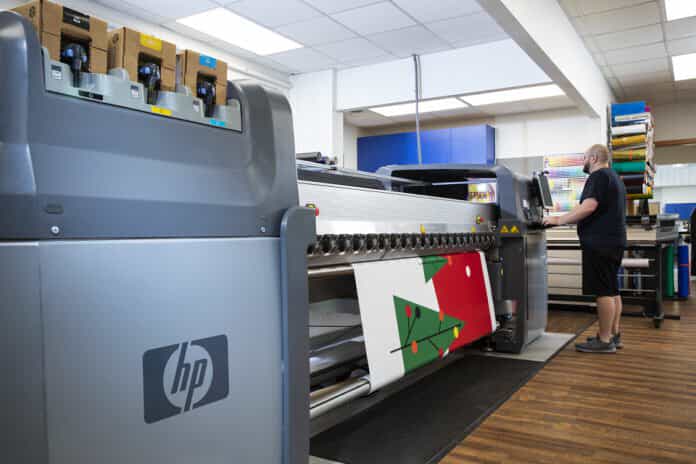 The Appleton FASTSIGNS showcasing an HP printer at work