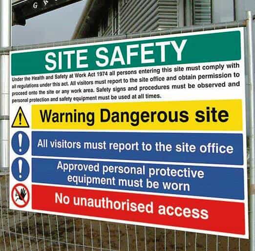 A large sign indicates safety measures for a construction site