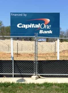 A large sign shows that Capital One financed an area