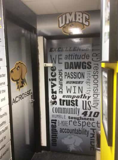 decals decorate doors and walls for UMBC athletic department