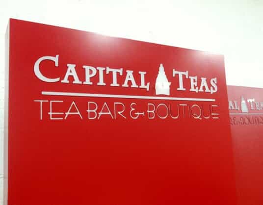 capital teas has an engraved sign